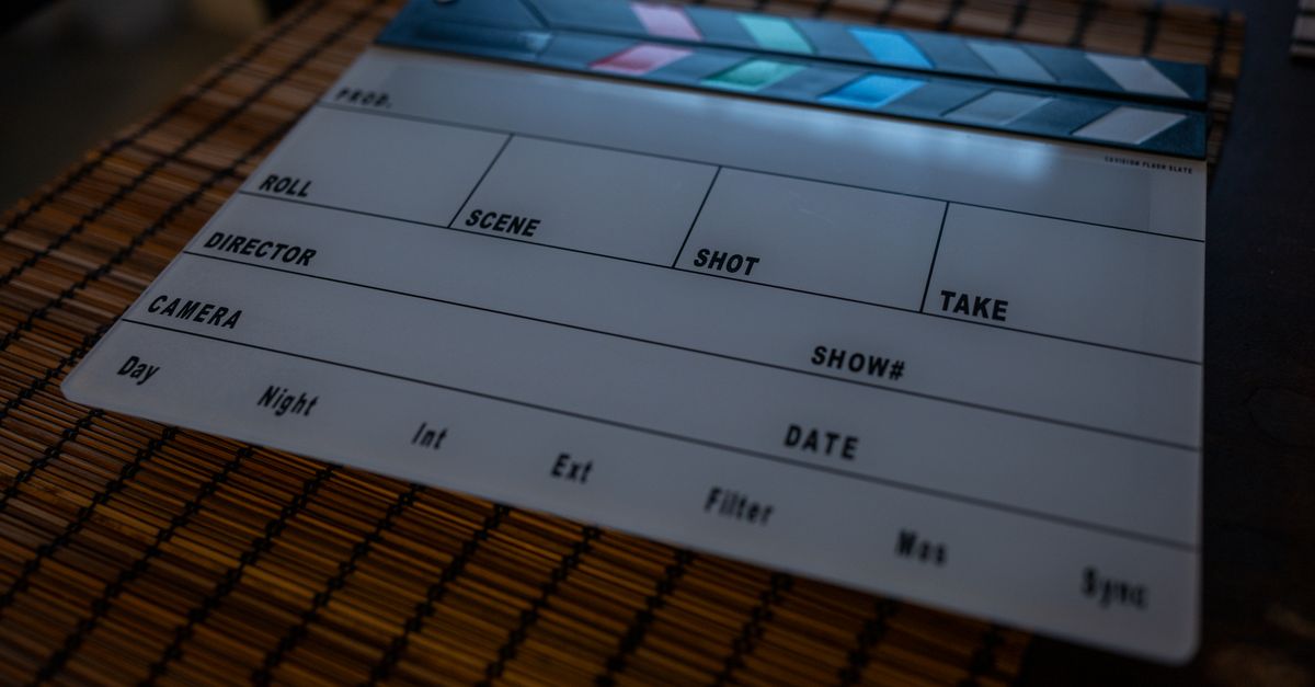 Close-up of a film clapperboard on a bamboo mat, ideal for filmmaking concepts.